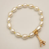 White pearl bracelet and Eiffel Tower pendant