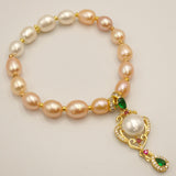 Bracelet perles champagnes/blanches et pendentif zircons /perle bouton