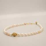 White pearl and charm necklace