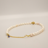 White pearl and charm necklace