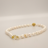 White pearls and charm set